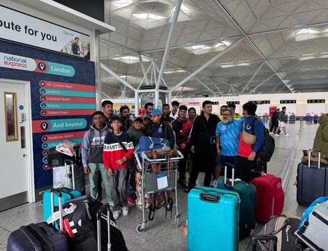 Player playing a basketball at sports academy event